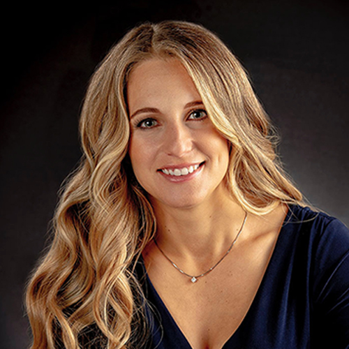 woman with blonde hair smiling, portrait photo