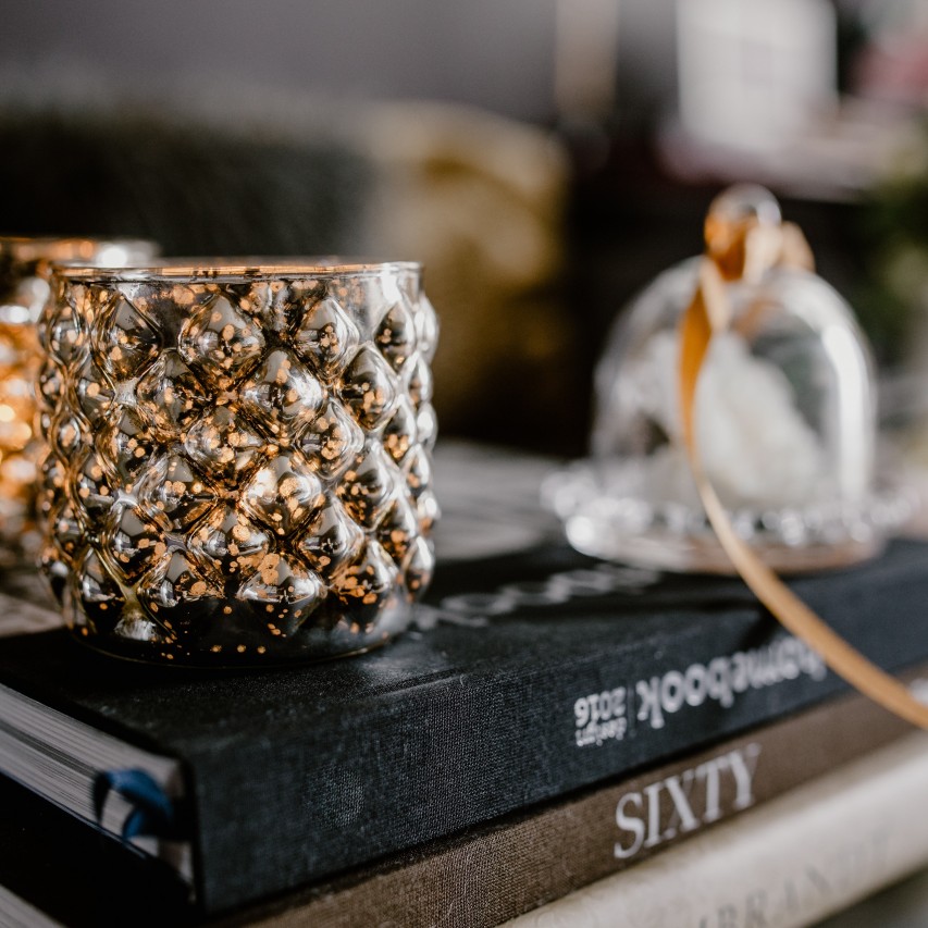 cup on top of books